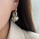 Brinco de Cascata Roxa Brilhante <strong>(COMPRE 1 PAR LEVE 2)</strong>